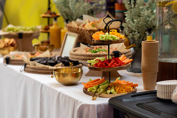 istock Vibrant vegetable platter displaying fresh, colorful appetizers arranged neatly on wooden catering buffet table 2233902221