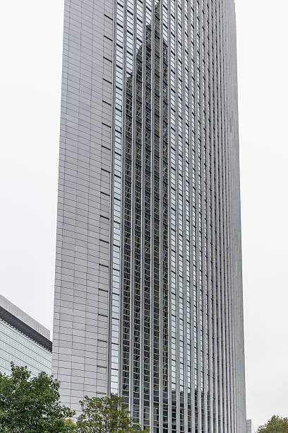 istock Modern skyscraper reflecting another building in its glass facade 2233905631