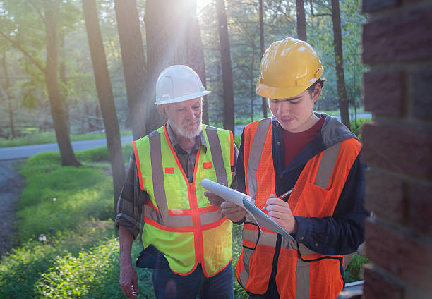 istock Engineer contractor trains autistic assistant in safety protocols at a Pennsylvania worksite. 2233907372