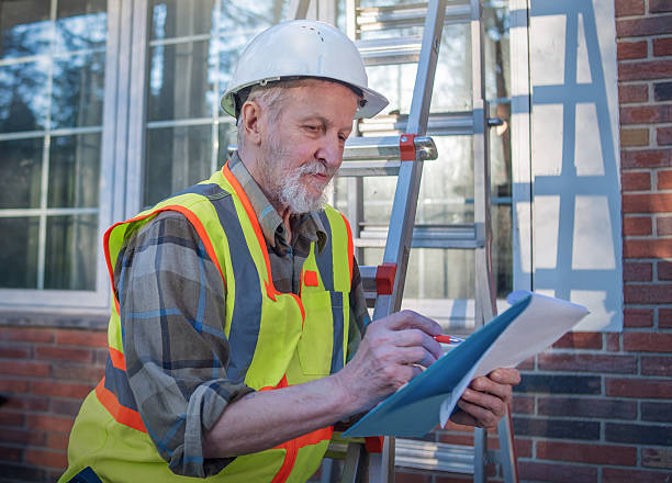istock Technician reviews documentation beside ladder in Pennsylvania. 2233907396