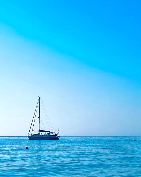 istock A sailboat in a calm sea 2233919620