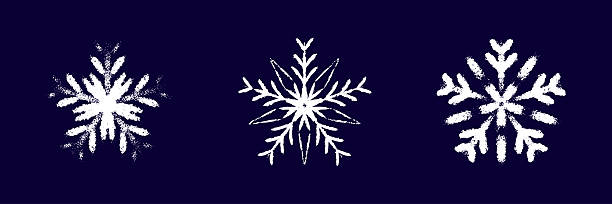 Childish snow flake white chalk drawing on dark blue blackboard. Crayon, pastel whimsical snowflakes hand drawn scribbles. Merry Christmas and Happy New Year winter design elements