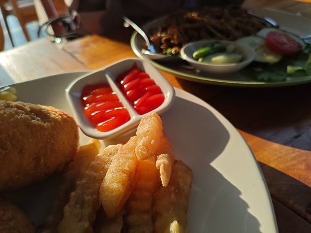 Serving potatoes and sauce on a plate