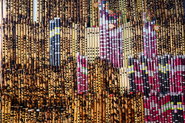 istock Traditional Handcrafted Bamboo Flutes Displayed in a Vibrant Market Setting 2233942766