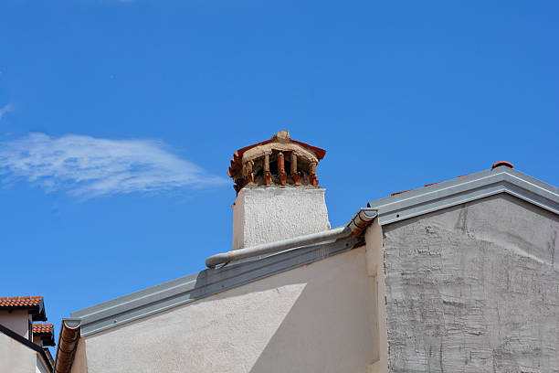 istock ROOF WITH A CHIMNEY 2233943520