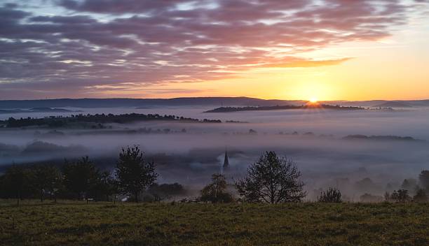 istock Serene sunrise over misty rural landscape. 2233947063