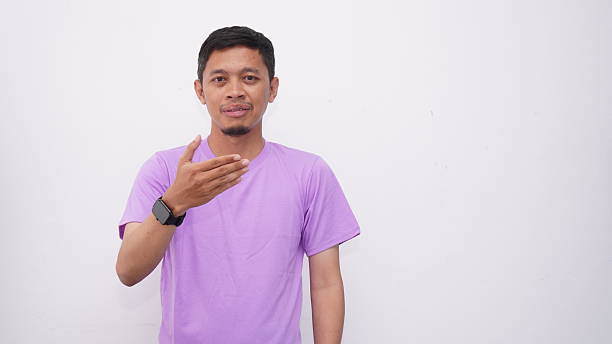 istock Asian Young men gesturing sign language isolated on white background 2233948789
