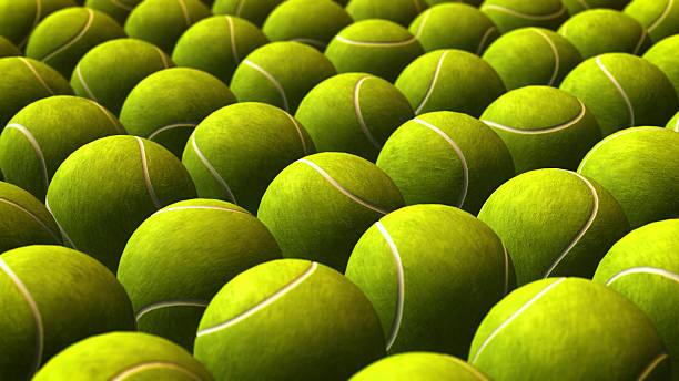 istock Abstract Pattern of Green Tennis Balls Background 2233948939