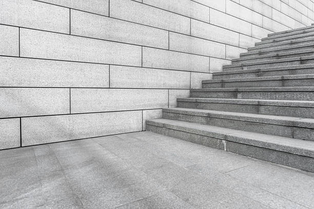 istock Concrete Staircase with concrete wall out of building - side view. 2233949113