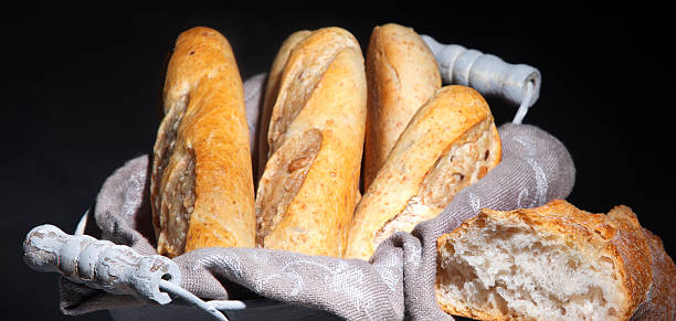 istock Bread  on black background. Traditional bakery concept. 2233949538