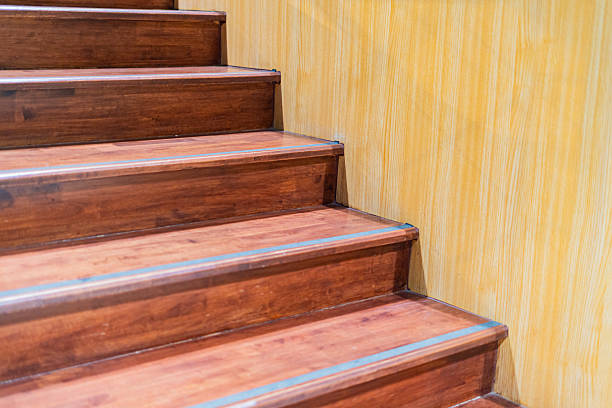 istock Wooden stairs leading up and down the building 2233953776