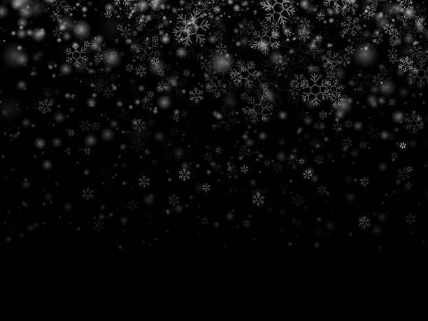 istock Falling snow on a dark black background. Winter scene with heavy snow, realistic snowflakes, and isolated snowfall. Overlay stock photo for Christmas designs and digital artwork. Night snowfall. White snowflakes. Isolated effect for overlays. Snow flakes. 2233955316