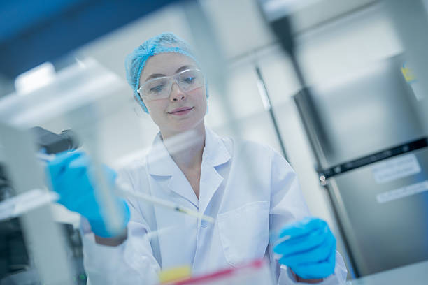 istock Scientist conducts research with pipette in a laboratory during daytime 2233955792