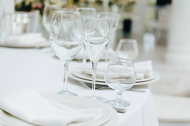 istock Elegant table setting with glassware in a bright venue 2233956235
