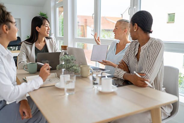 istock Professional women collaborating in a bright office space at a meeting 2233957217