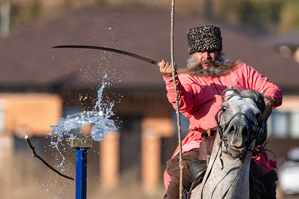 Zheleznovodsk - September 5: The Cossack rides on horseback and cuts the target with a sword on the move. September 5, 2025 in Zheleznovodsk, Russia