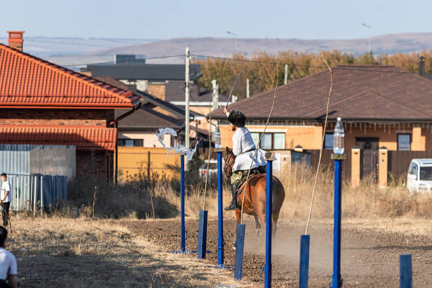 Zheleznovodsk - September 5: The Cossack rides on horseback and cuts the target with a sword on the move. September 5, 2025 in Zheleznovodsk, Russia