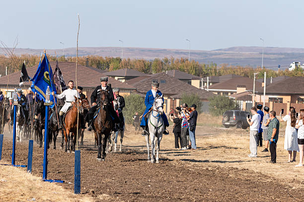Luzarches, France - October 13 2019: Two men dressed as knights Jousting on their horses during the annual 'Médiévales' festival. In autumn, in many medieval towns in France, festivals are held where people can disguise in knights, monks, farmers... of the medieval period.