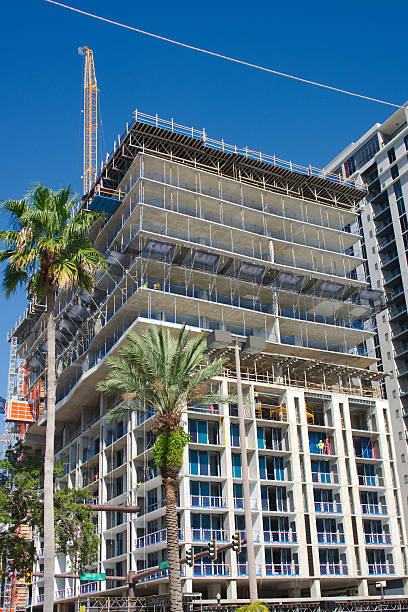 istock High-Rise Building Under Construction With Scaffolding and Workers 2233961434