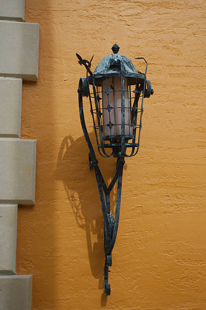 istock Antique Street Lantern on Vibrant Orange Wall with Rustic Atmosphere 2233961549