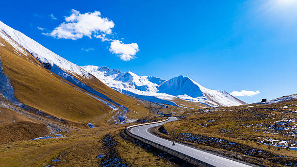 istock Aerial view  on the road surrounded by winter Landscape view 2233963360