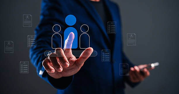 istock A professional individual interacts with digital icons representing people and documents, 2233963809
