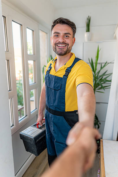 istock Friendly handyman offering services in modern home interior setting 2233964731
