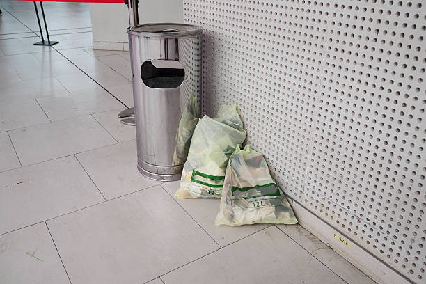 istock Stainless steel trash can, beside it there is a plastic trash bag 2233965496