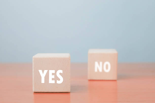 istock Wooden blocks with YES and NO text on table, symbol of decision making, correct and wrong choice, agreement or rejection, business strategy, voting, and evaluation concept. 2233965938