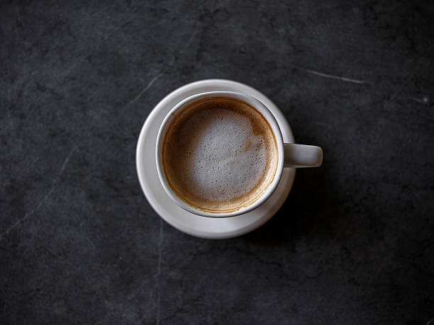 istock delicious espresso on black granite table 2233968325