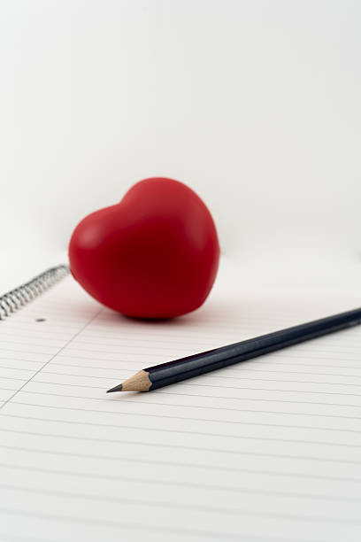 istock Writing a letter with feelings and heart 2233968469