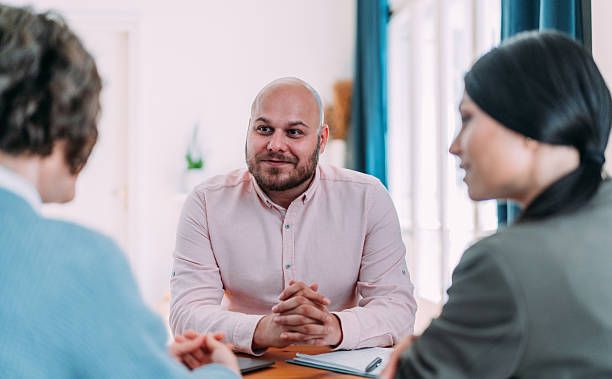 istock Group of business persons talking in the office. 2233970088