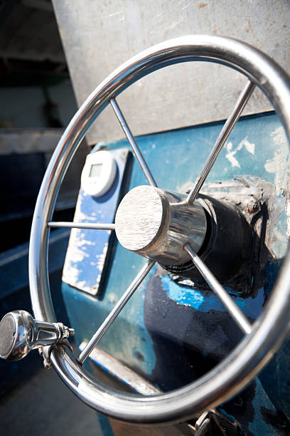 old steering wheel on ship