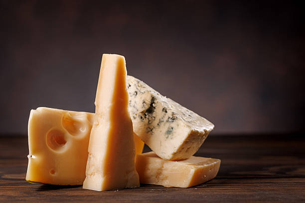istock Assorted cheeses in different shapes and textures displayed together 2233970739