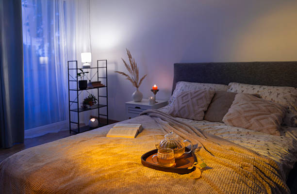 istock cup of tea on cozy bed with autumn decorations 2233972866