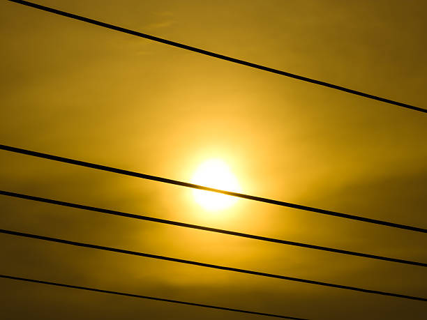 Golden Hour Sunset Through Power Lines