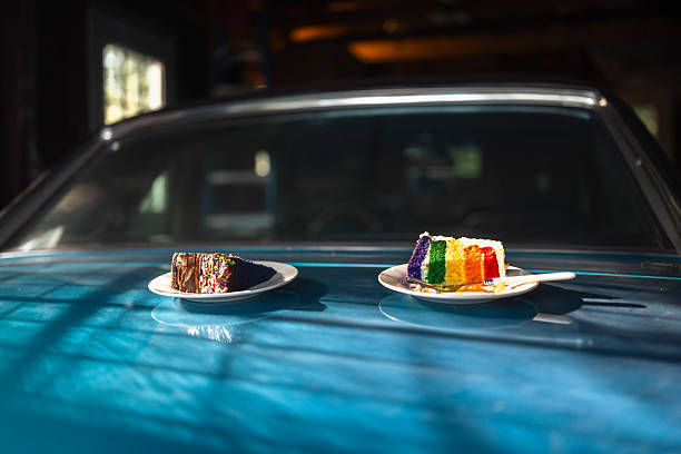 istock Colorful Rainbow Cake Slice and Chocolate Cake on Car 2233979811