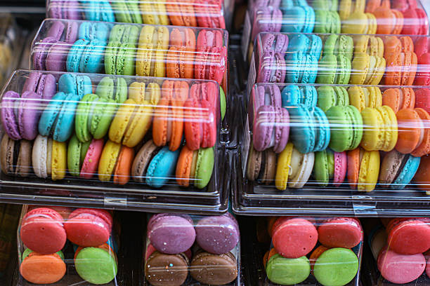 istock Assorted macarons with glossy shells and creamy filling in takeaway packaging. 2233984866