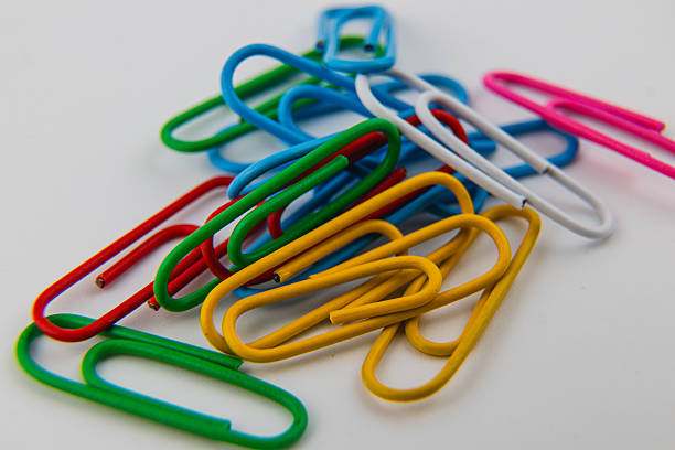 istock Colorful paper clips arranged in a vibrant pile on a white surface 2233986090