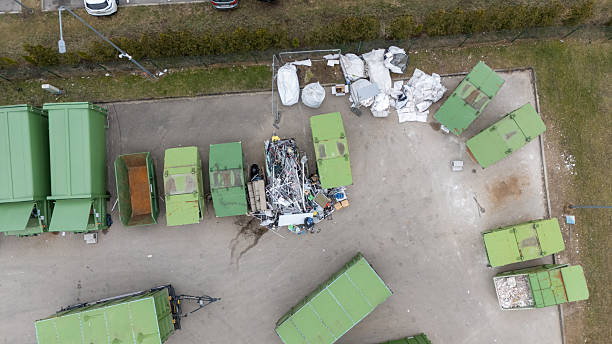 istock Aerial view of a waste disposal site with green dumpsters 2233988005