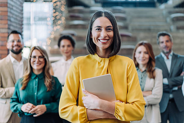 istock Confident businesswoman and her team. 2233988850