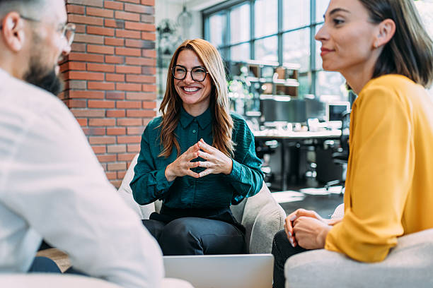 istock Group of business persons talking in the office. 2233988926