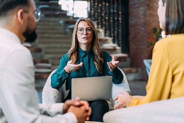 istock Group of business persons talking in the office. 2233988933