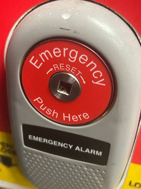 istock Close-Up of Emergency Alarm Button with Red Color and Instructions 2233990889