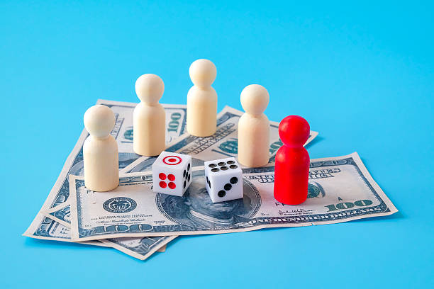 istock Dice game on bank note and wood toy.bets and risk. 2233992338