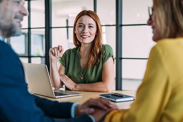 istock Group of business persons talking in the office. 2233992355