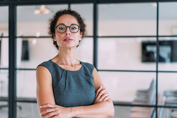 istock Confident businesswoman in modern office. 2233992437