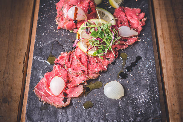 Plate of cecina de Leon (Leon cured meat), made of the hind legs of a cow, salted, smoked and air-dried, typical in Castile and Leon, Spain