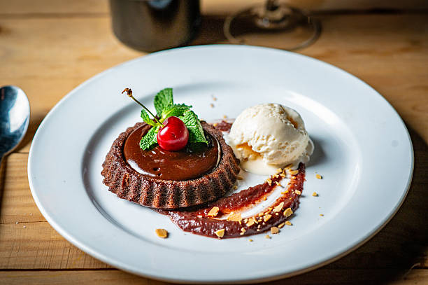 Delicious Chocolate Dessert with Vanilla Ice Cream Served on a White Plate