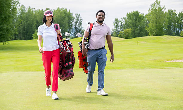 istock Multiracial Couple Playing Golf In The Course 2233996031